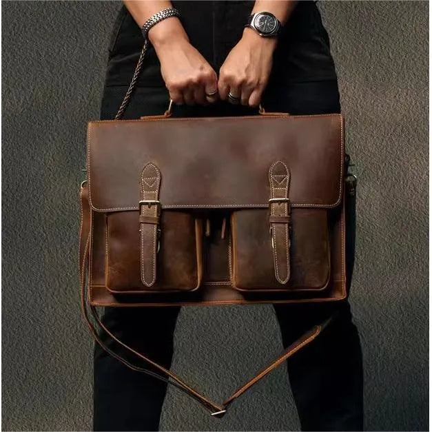 Top cowhide leather computer bag in dark brown with crossbody strap and sewing line detailing