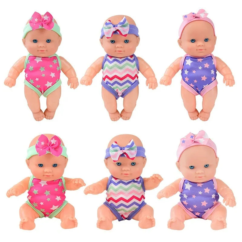 Vinyl baby figurine doll in display with colour variations and measurement scale