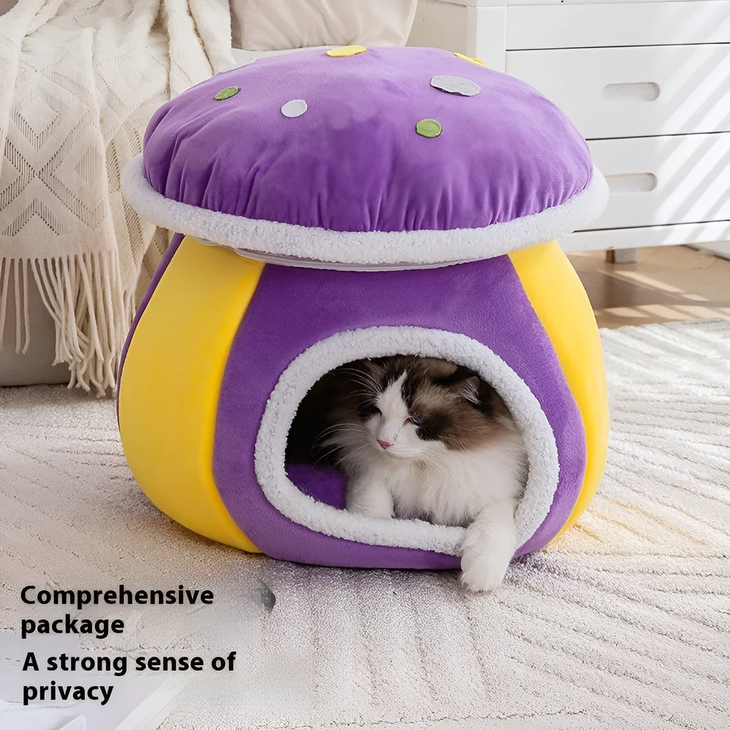 Grey mushroom-shaped plush cat bed with a detachable blanket inside, shown on a wooden floor.