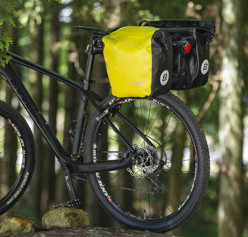 Bicycle waterproof bag made of nylon cloth and waterproof fabric, black colour, shown on a bike for cycling storage
