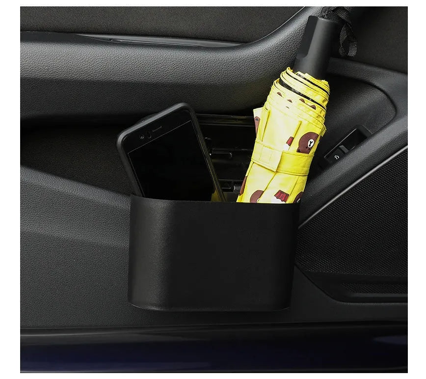 Black ABS plastic car trash can measuring 160x143x85mm with removable hook and upturned lid