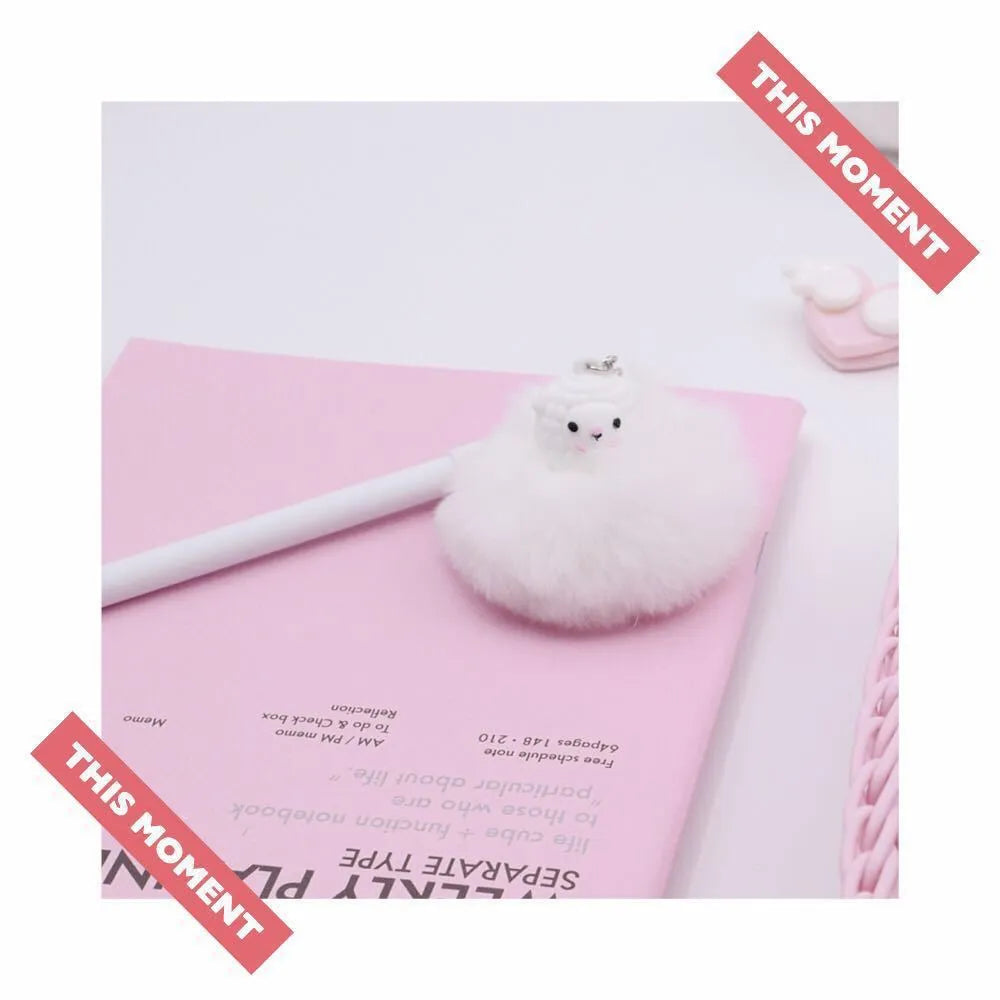 Alpaca hair ball charm pendant on a 17cm long plastic pen with a 0.5mm fine tip.