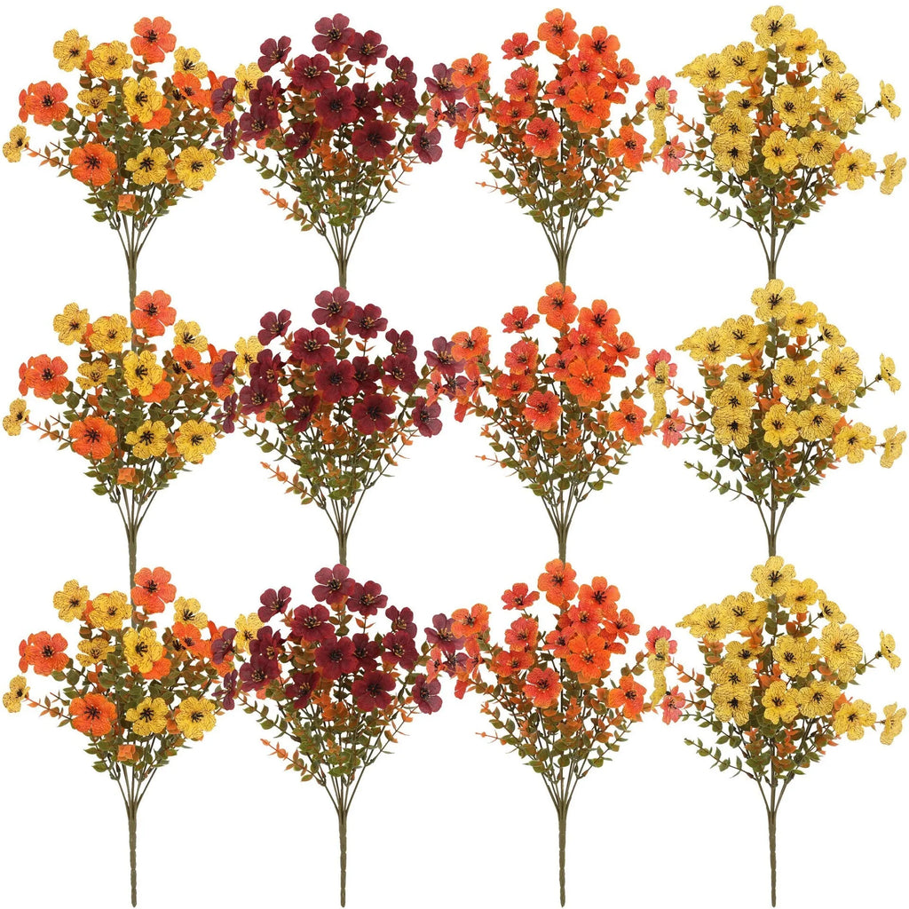 Artificial silk flower bouquet in autumn red, yellow, and orange colours for home or wedding decoration.