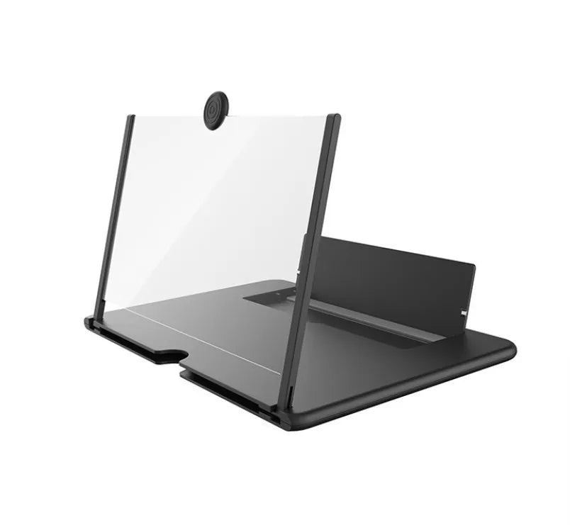 Folding mobile phone screen amplifier in black, with phone inserted, showing 3-4x magnification on a desk