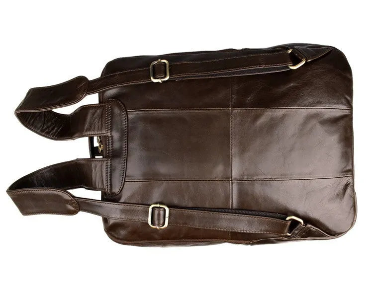 Top layer leather computer backpack in brown colour with zip closure designed to fit a 15 inch laptop
