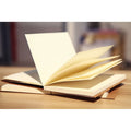 Brown and white kraft paper sketchbooks with lay-flat binding, shown in 16K and 32K sizes.