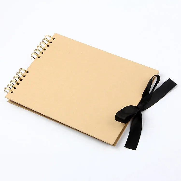 DIY handmade photo album with coil binding in yellow or black, showing its 290mm by 215mm size.