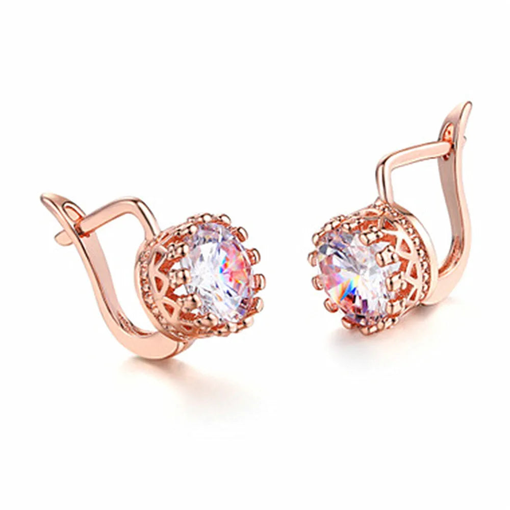 Korean retro crown design ear clip earrings in rose gold or white gold finish with white diamond accents.