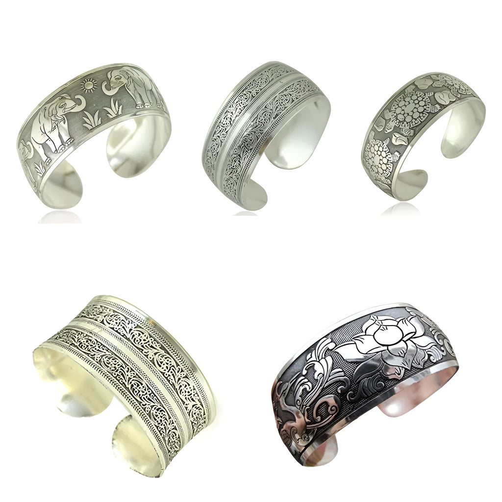 Ethnic carved open Miao silver bracelet with Roman patterns showing elephant and turtle motifs