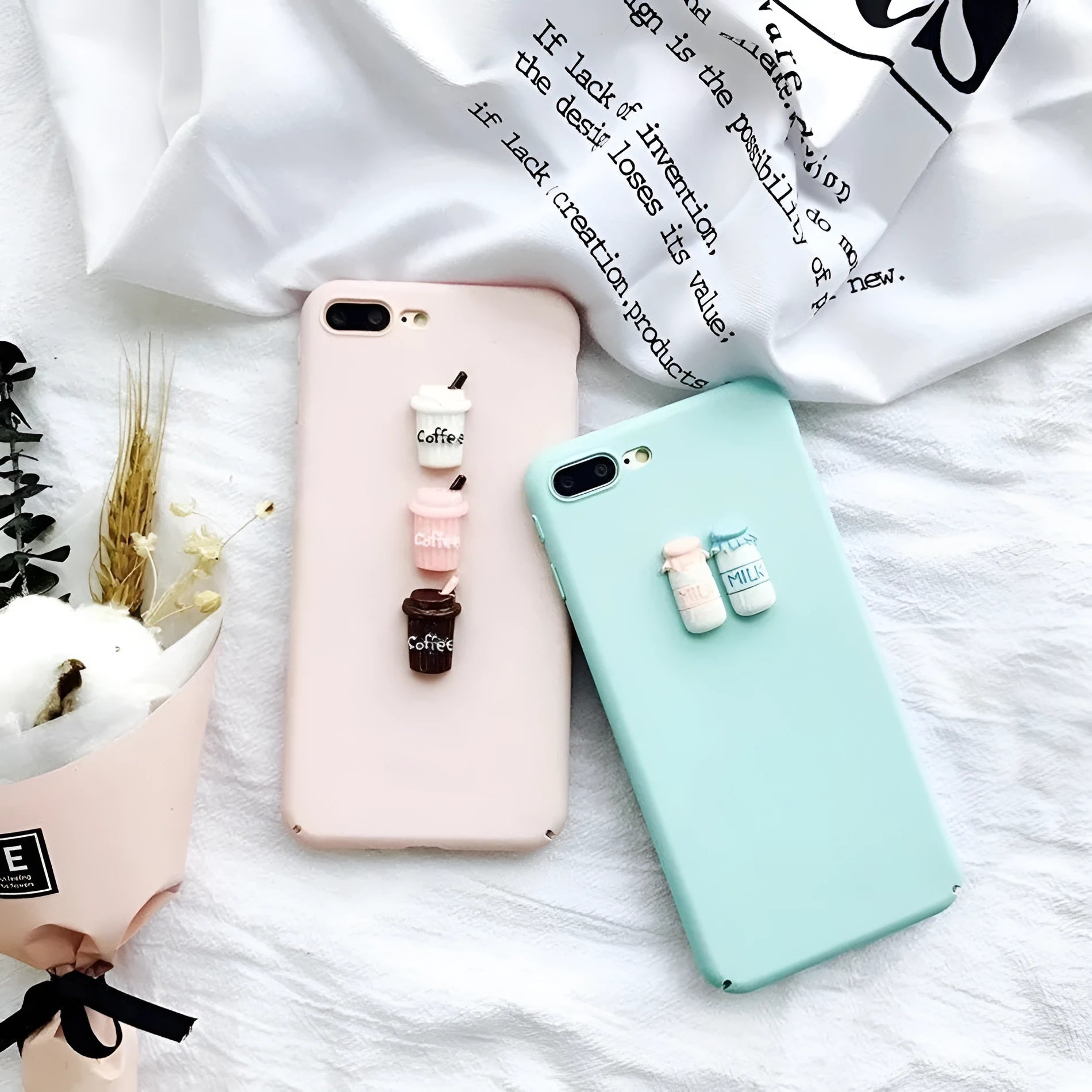 Soft pink silicone iPhone case with a raised 3D cartoon cat design, shown fitted on a phone.
