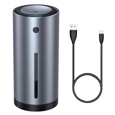 Black aluminium alloy car diffuser humidifier with USB cable on a car dashboard.