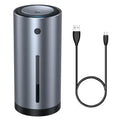 Black aluminium alloy car diffuser humidifier with USB cable on a car dashboard.