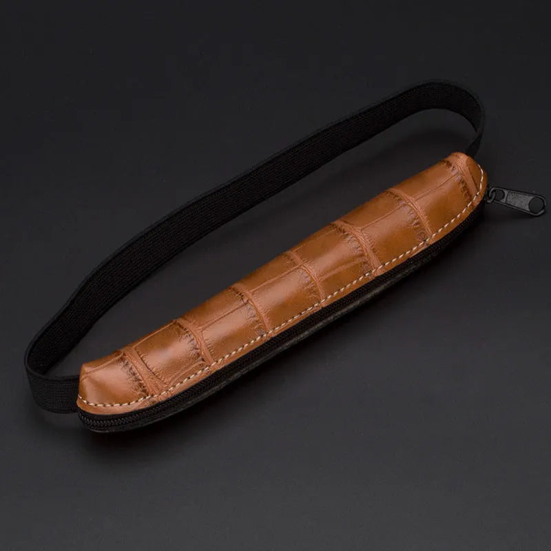 Slim 16.5cm long PU leather office pencil case in beige grey on a desk
