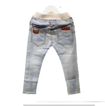 Boys' striped denim harem trousers with an elasticated waistband on a hanger.