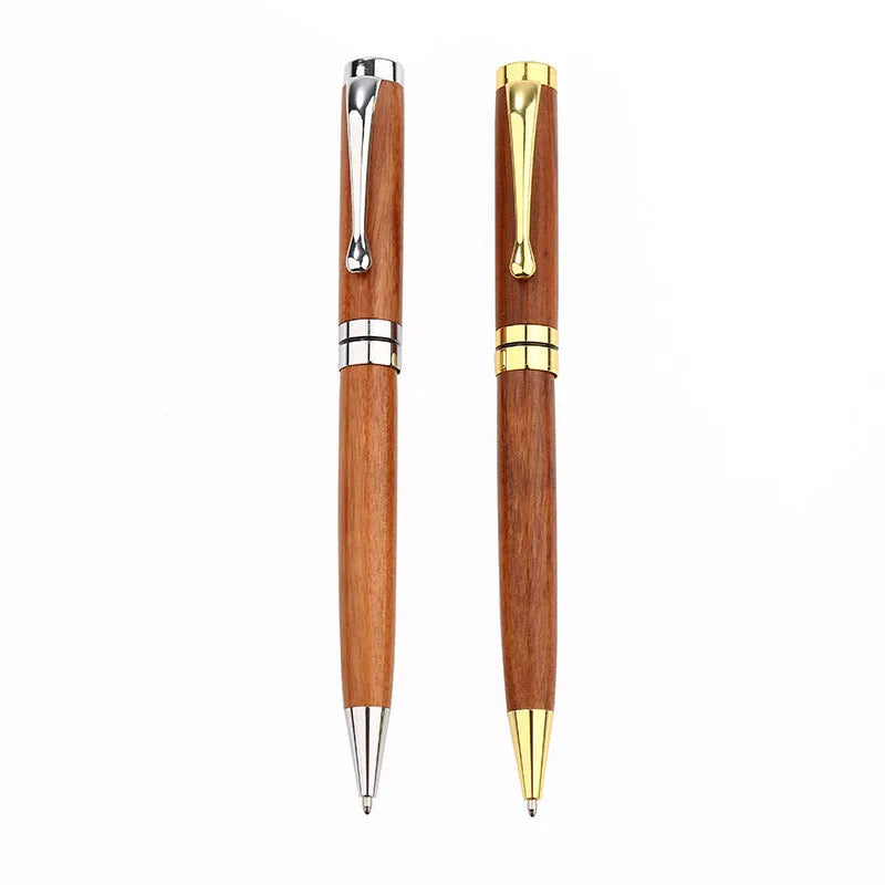 Gold metal and rosewood rollerball pen on a desk, 14cm long