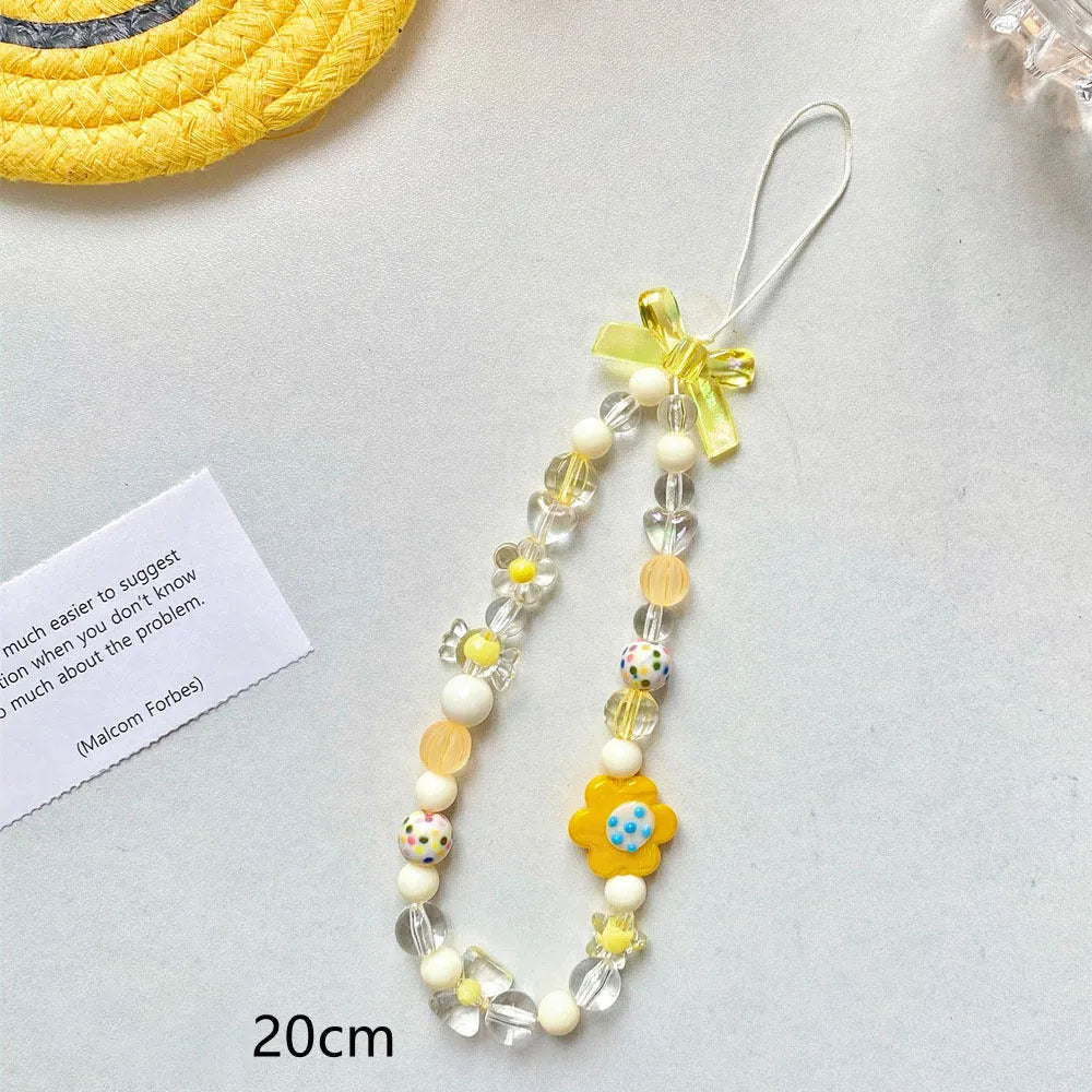 Colourful beaded floral phone lanyard in blue, pink, or yellow on a rope cord.