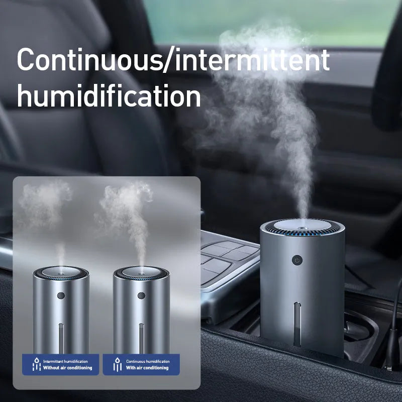 Black aluminium alloy car diffuser humidifier with USB cable on a car dashboard.