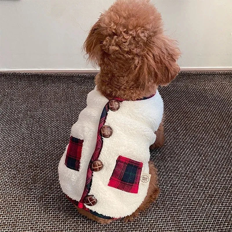 Navy blue pet fleece jacket with checkered pattern, Sherpa lining, decorative buttons, and snowman accent on a small dog