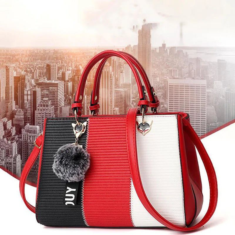 Women handbag made of PU leather with patchwork design and hairball ornaments in grey, pink, purple, and red colour options