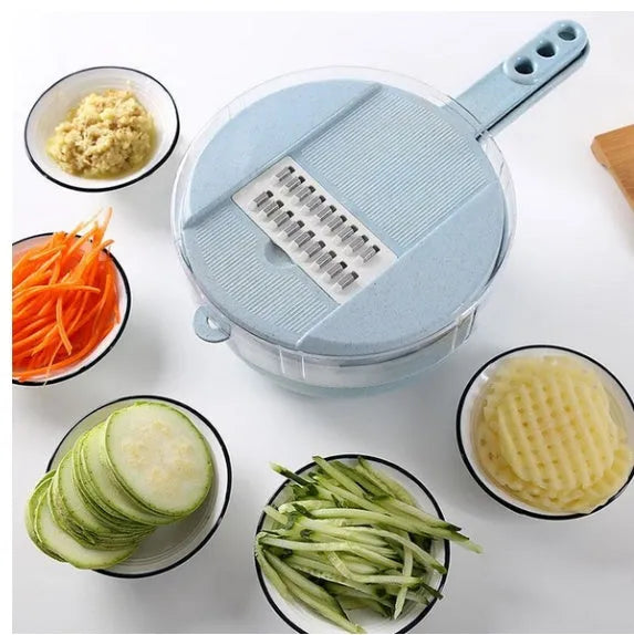 Blue 8-in-1 mandoline slicer with stainless steel blades, container, hand protector, and drain basket on kitchen counter