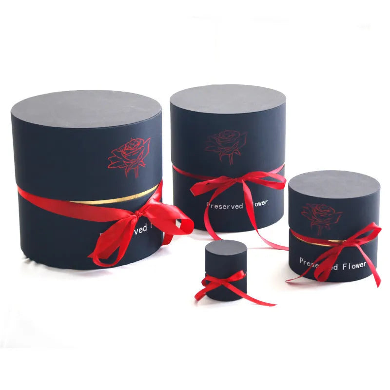 Luxury gift box open to display preserved real red roses, a Valentine's Day gift set.