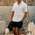 Man wearing a grey waffle texture short sleeve shirt and matching shorts for summer.