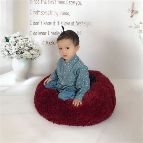 Round long hairy cat bed in plush fabric with anti-slip bottom for autumn and winter