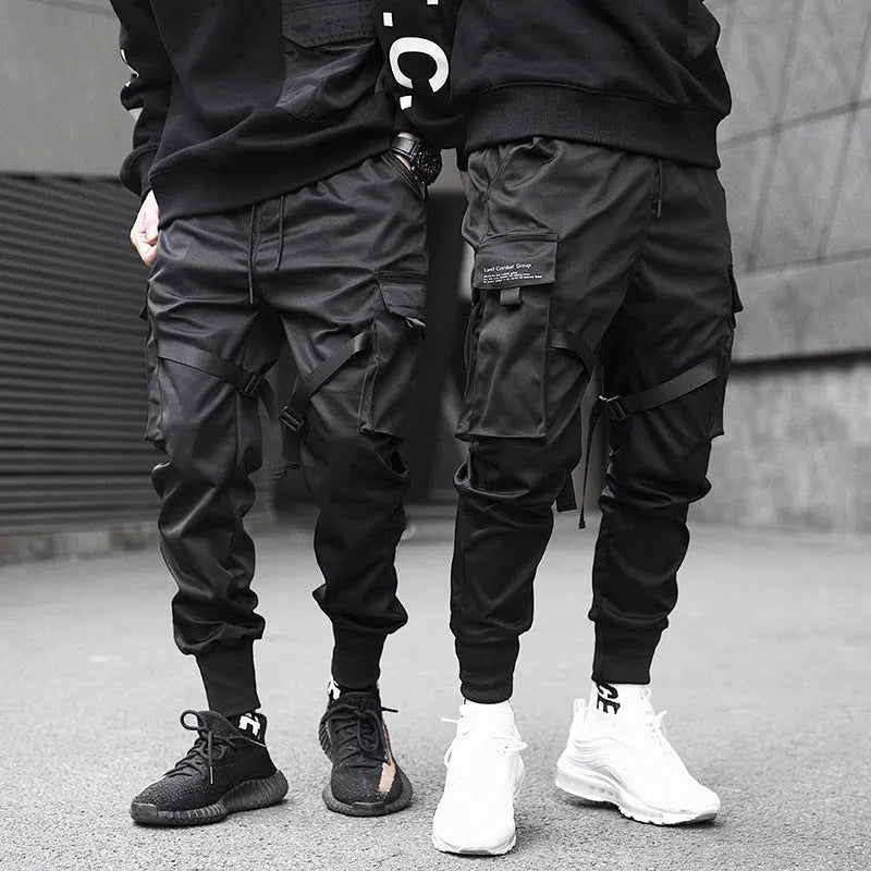Black 100% cotton overall trousers with tapered leg, front view, on a plain background.
