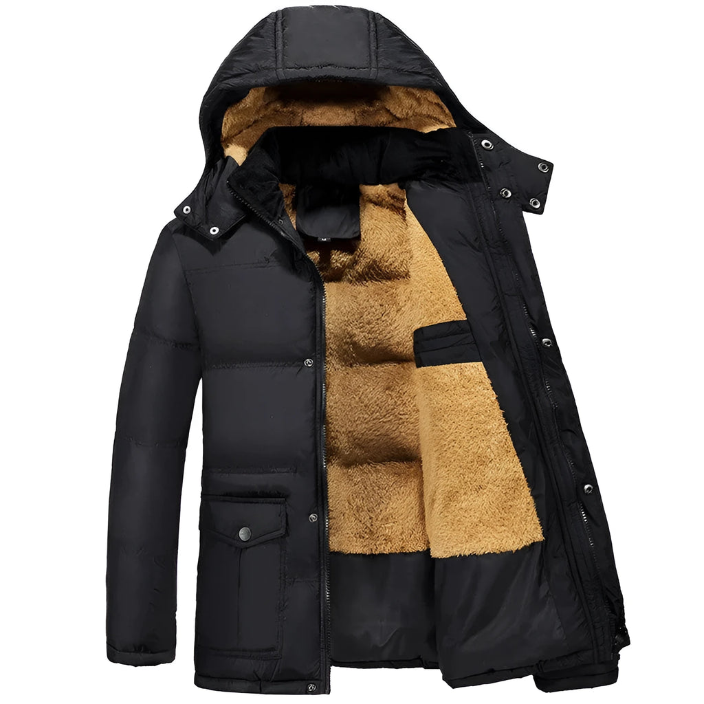 Man wearing a black hooded, double-breasted padded jacket with a velvet lining.
