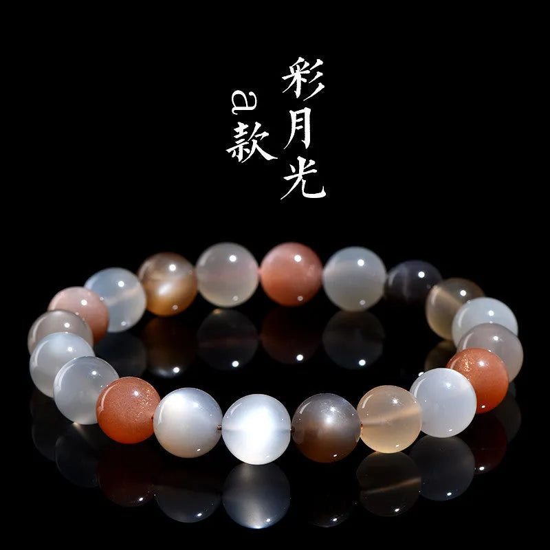 Natural colourful moonlight moonstone bracelet with 8mm single circle beads on a wrist.