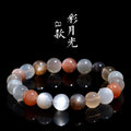 Natural colourful moonlight moonstone bracelet with 8mm single circle beads on a wrist.