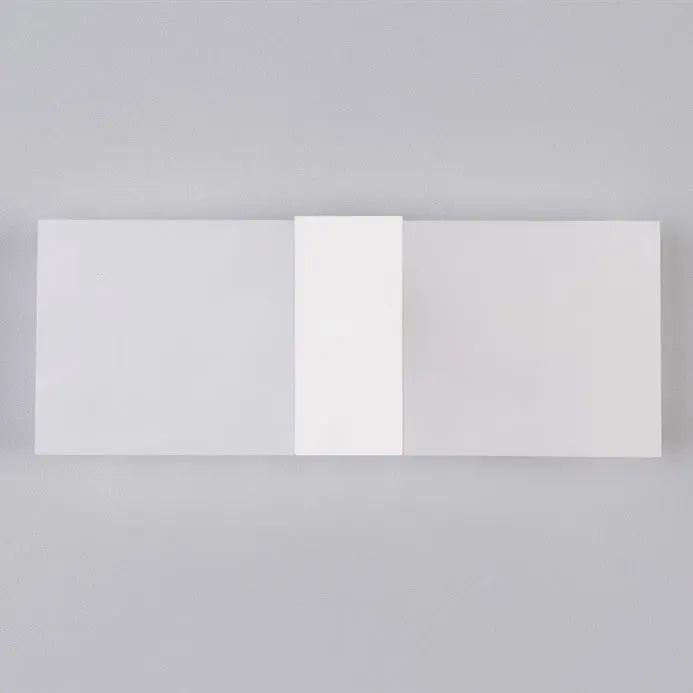 Modern acrylic LED wall lamp in black finish mounted on corridor wall