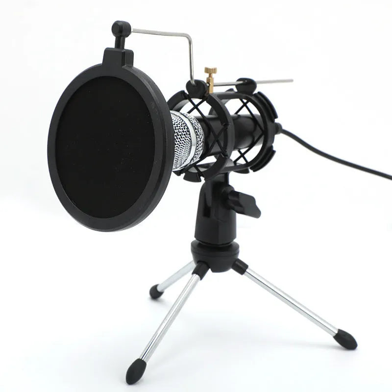 Black condenser microphone on aluminium stand with 3.5mm and USB cables for mobile and computer broadcasting