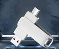 Rotating metal USB flash drive in black showing both USB connector and Type-C interface