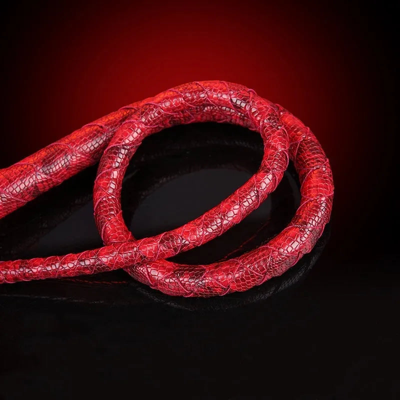 Red PU willow leaf whip BDSM training tool on black background