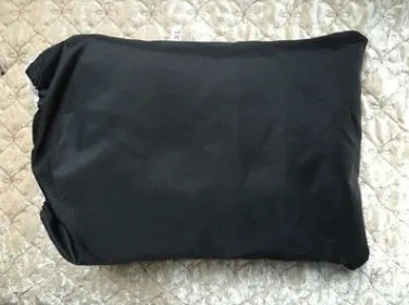 Black universal car seat cover made from 180T polyester measuring 132x54cm with foldable storage bag