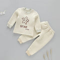 Infant warmer suit in cotton with cartoon stripe pattern and buckle closure in buckle camel colour