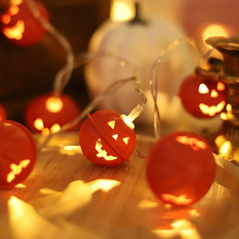 LED Halloween string lights with pumpkin-shaped iron pendants in warm white, 1.65m length with 10 lights displayed on a dark background