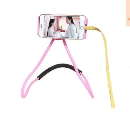 White universal neck phone holder with 360-degree rotating clamp on a table.