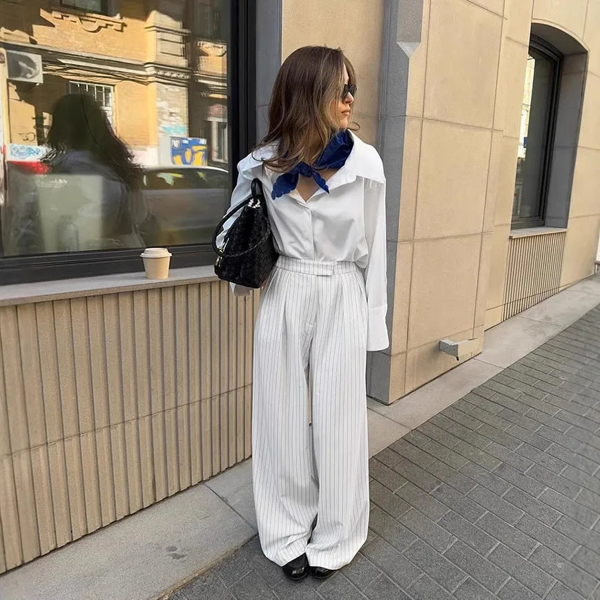 White striped wide-leg trousers with zipper detailing on loose casual silhouette