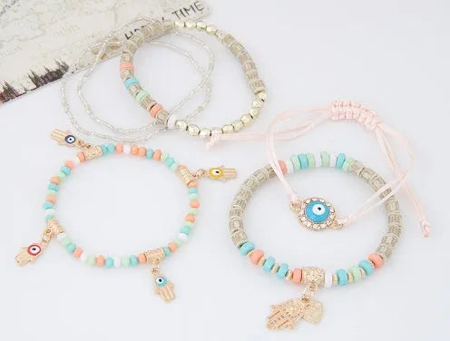 LEMOER multilayer charm bracelet with Hamsa hand, evil eye, and heart motifs in alloy and mixed beads