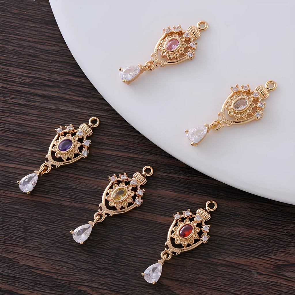 Small hollow water drop-shaped copper pendant with micro inlaid zircon detailing.