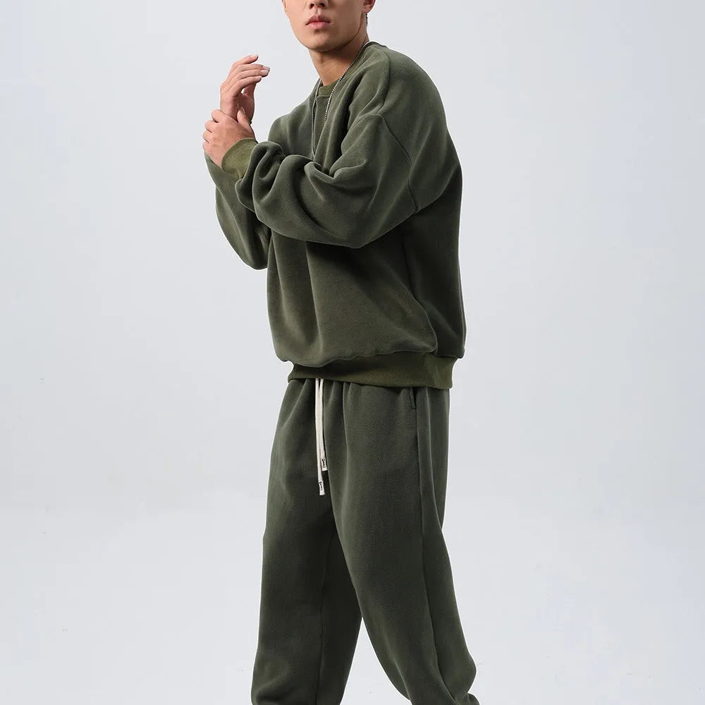Men's polar fleece winter sports suit two-piece set showing padded jacket and matching trousers