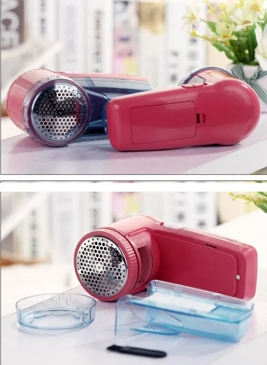 Compact white handheld electric lint remover for clothing, showing fabric shaving head.