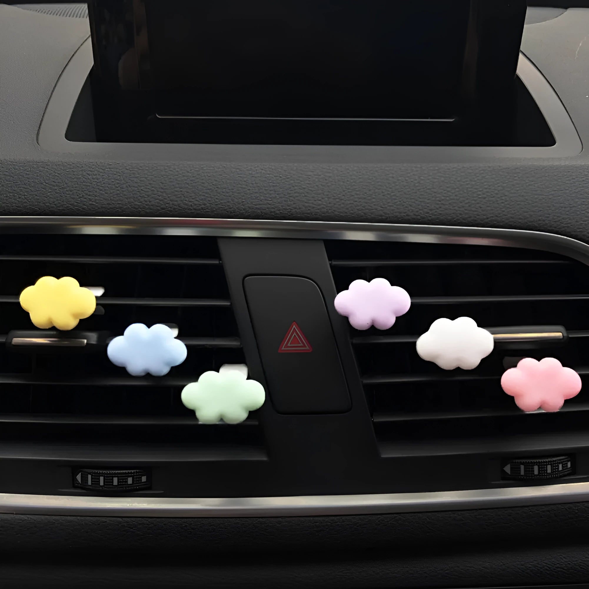 Resin Baiyun cartoon car air freshener clip in six colours on a car vent.
