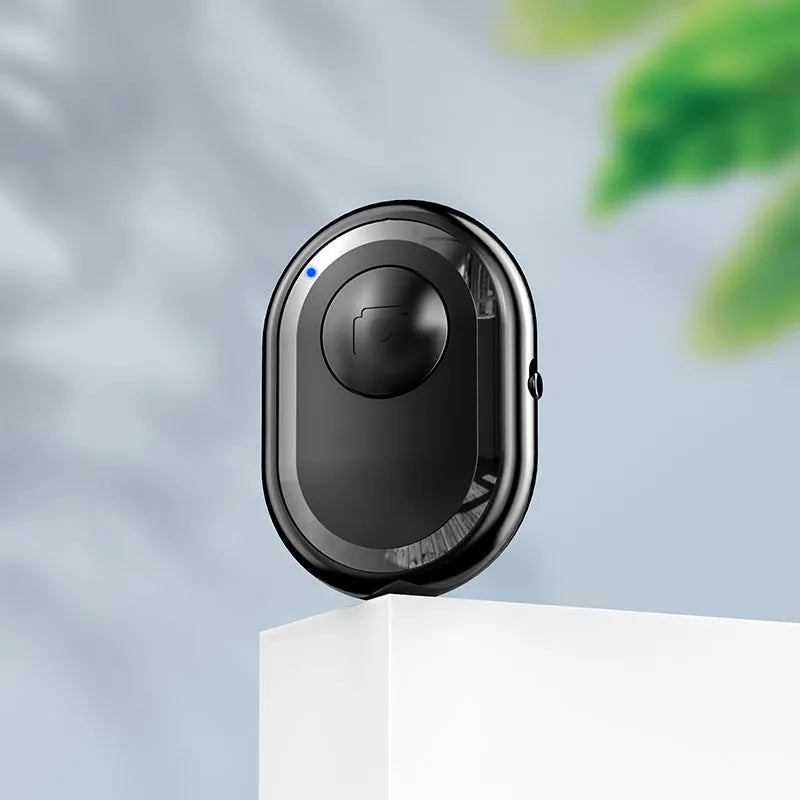 Wireless Bluetooth remote control for smartphone photography in black, pink, and purple colour options