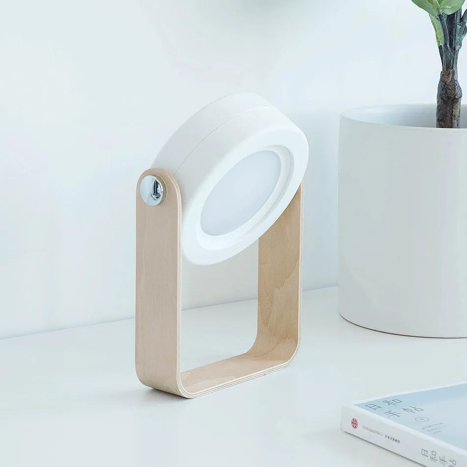 Foldable touch dimmable LED reading lamp in white showing table and lantern configurations