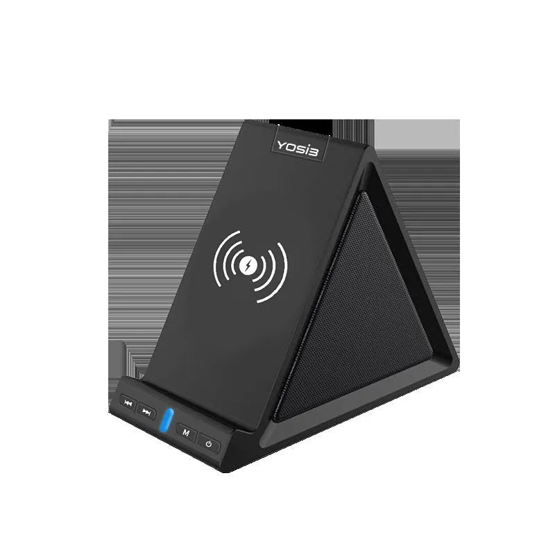 Black multifunctional Bluetooth speaker with integrated phone stand and wireless charging pad on a desk.