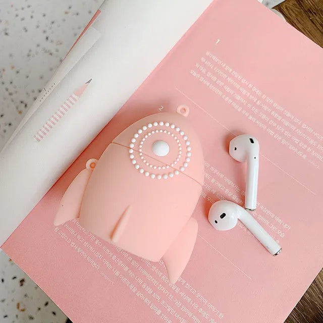 Pink silicone protective case on an AirPods wireless charging case.