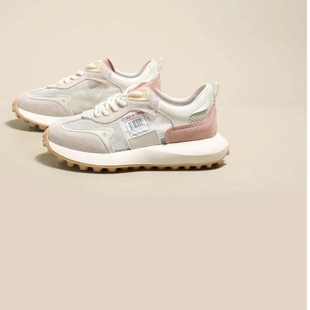 Women's grey and pink retro sneaker with low-top design and round toe